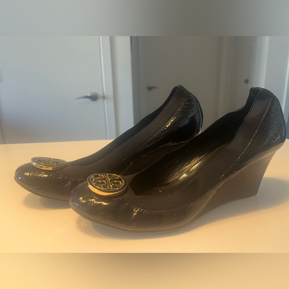 Tory Burch Black Patent Leather Wedge Pumps with Gold Logo